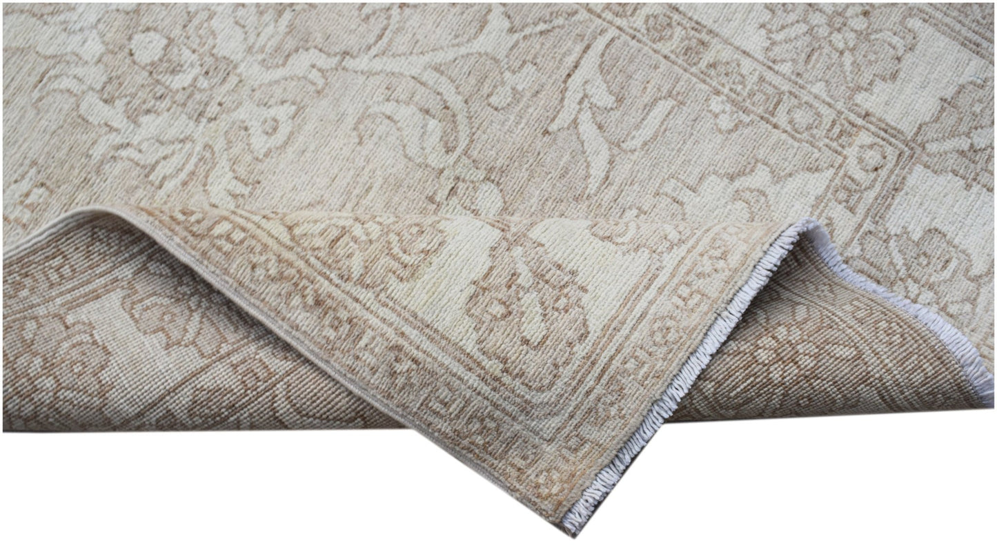 A handwoven Afghan Chobi runner featuring a traditional beige and cream floral pattern.
