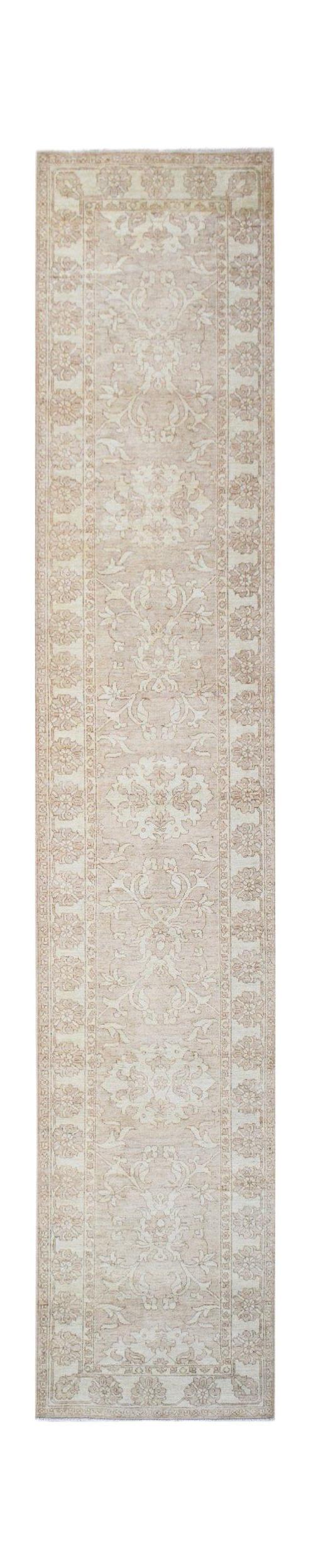 A handmade Afghan Chobi runner rug featuring traditional floral patterns in soft beige tones.