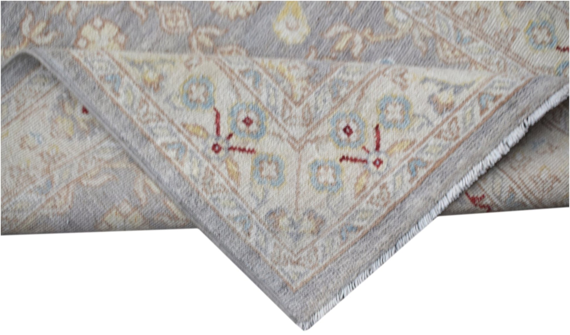 A handwoven Afghan Chobi runner featuring a traditional floral pattern in soft neutral tones.