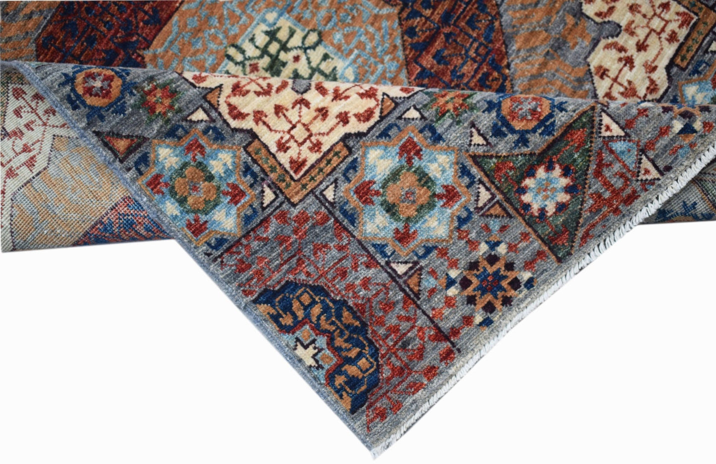 A handwoven Afghan Chobi runner featuring a detailed Mamluk medallion pattern in wool.