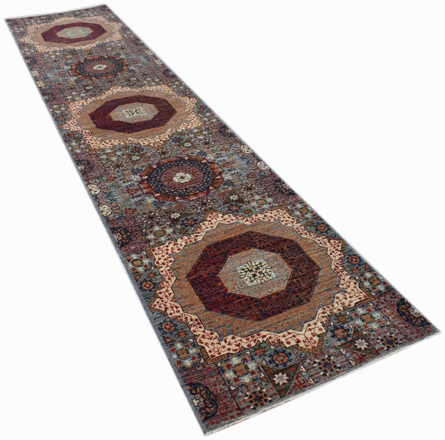 A handmade Afghan Chobi runner rug featuring a traditional Mamluk medallion pattern.
