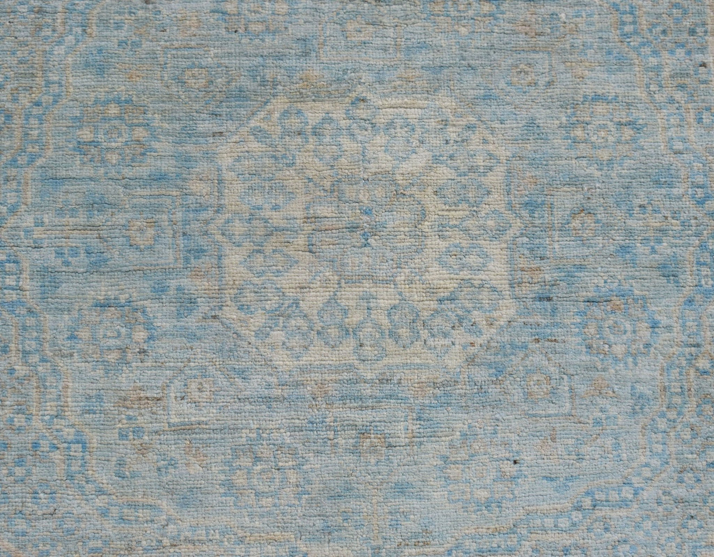 A handwoven Afghan Chobi runner featuring a detailed Mamluk medallion pattern in blue and cream.