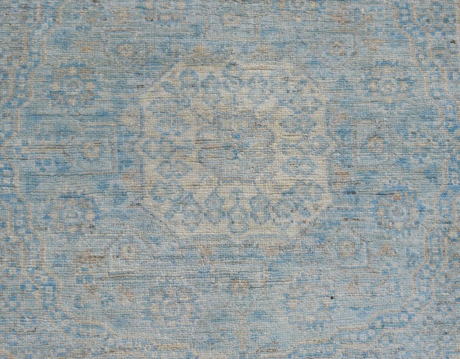 A handwoven Afghan Chobi runner featuring a detailed Mamluk medallion pattern in blue and cream.