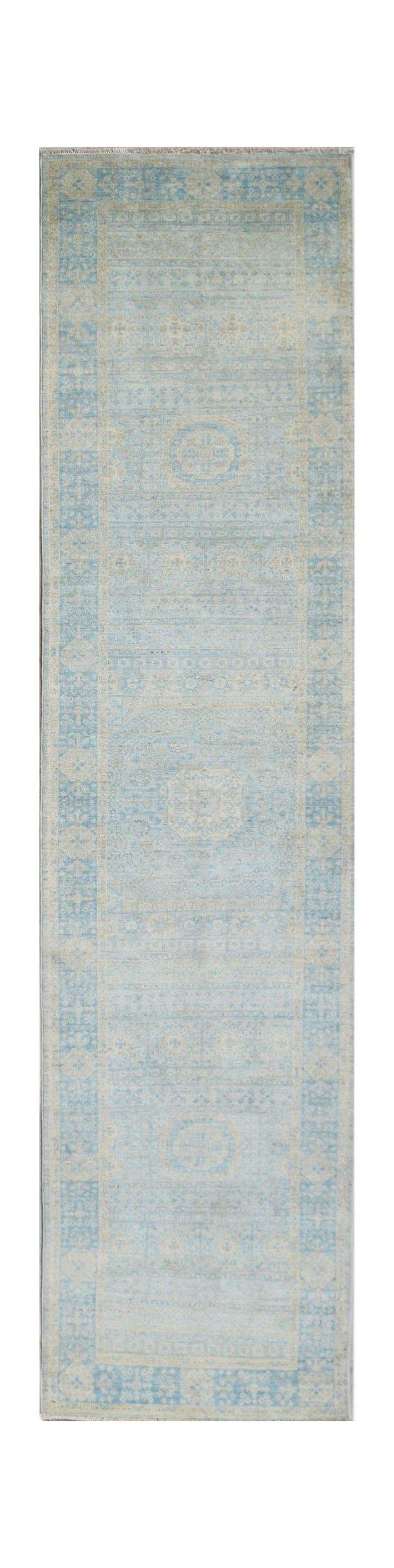 A handwoven Afghan Chobi runner rug featuring a light blue and beige Mamluk medallion pattern.
