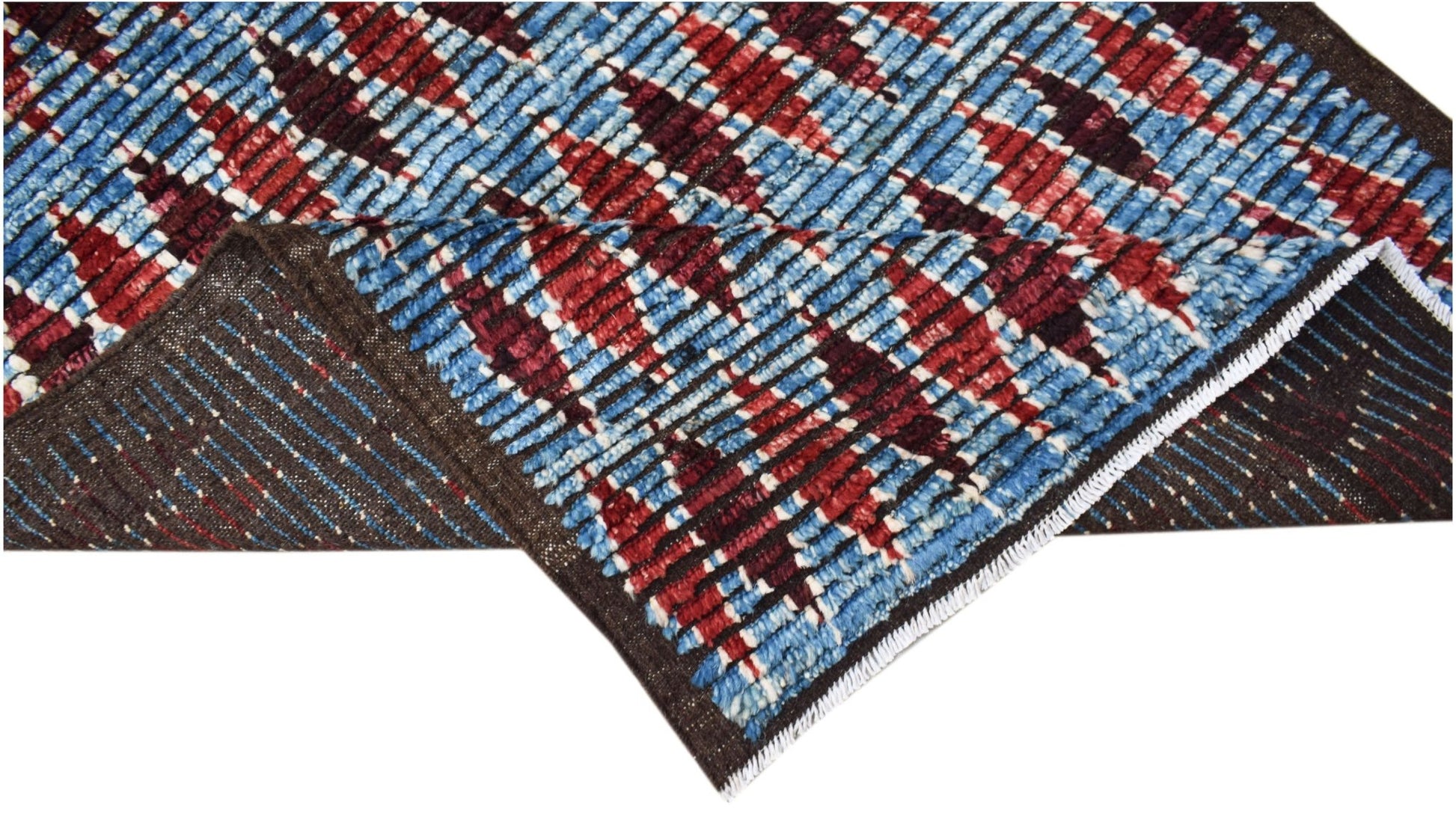 A hand-knotted Afghan Yekta rug featuring a geometric pattern in blue, red, and dark brown wool.