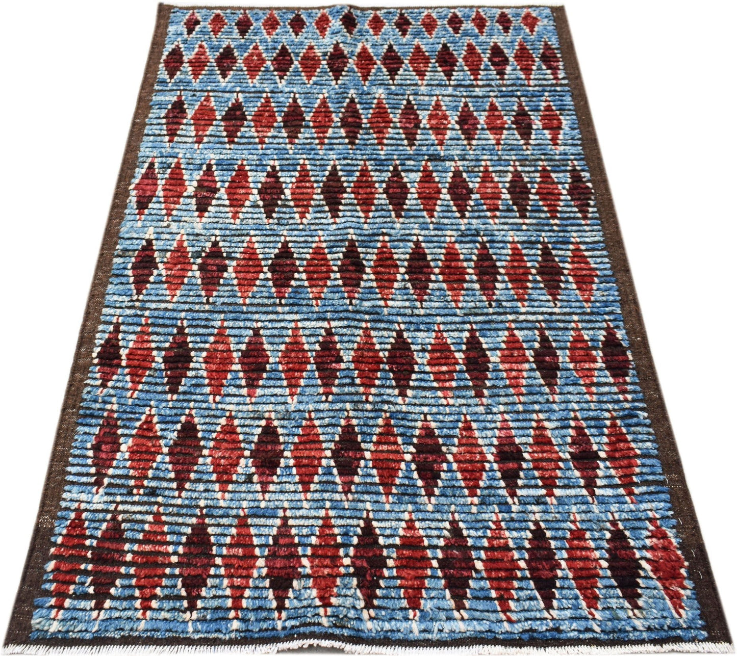 Hand-knotted Afghan Yekta rug featuring a blue background with a repeating red diamond pattern.