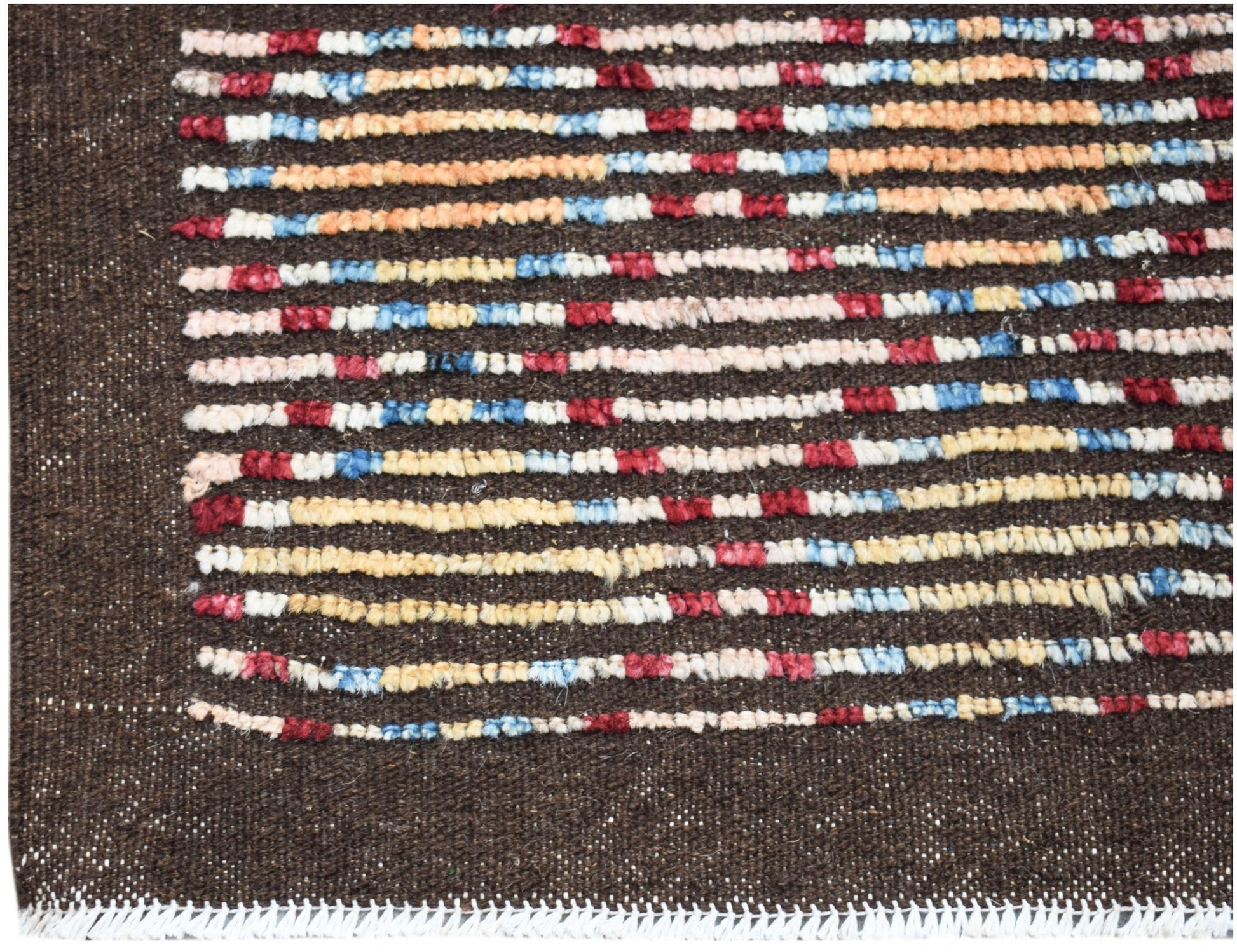 A hand-knotted Afghan rug featuring horizontal stripes of red, blue, and yellow on a brown field.