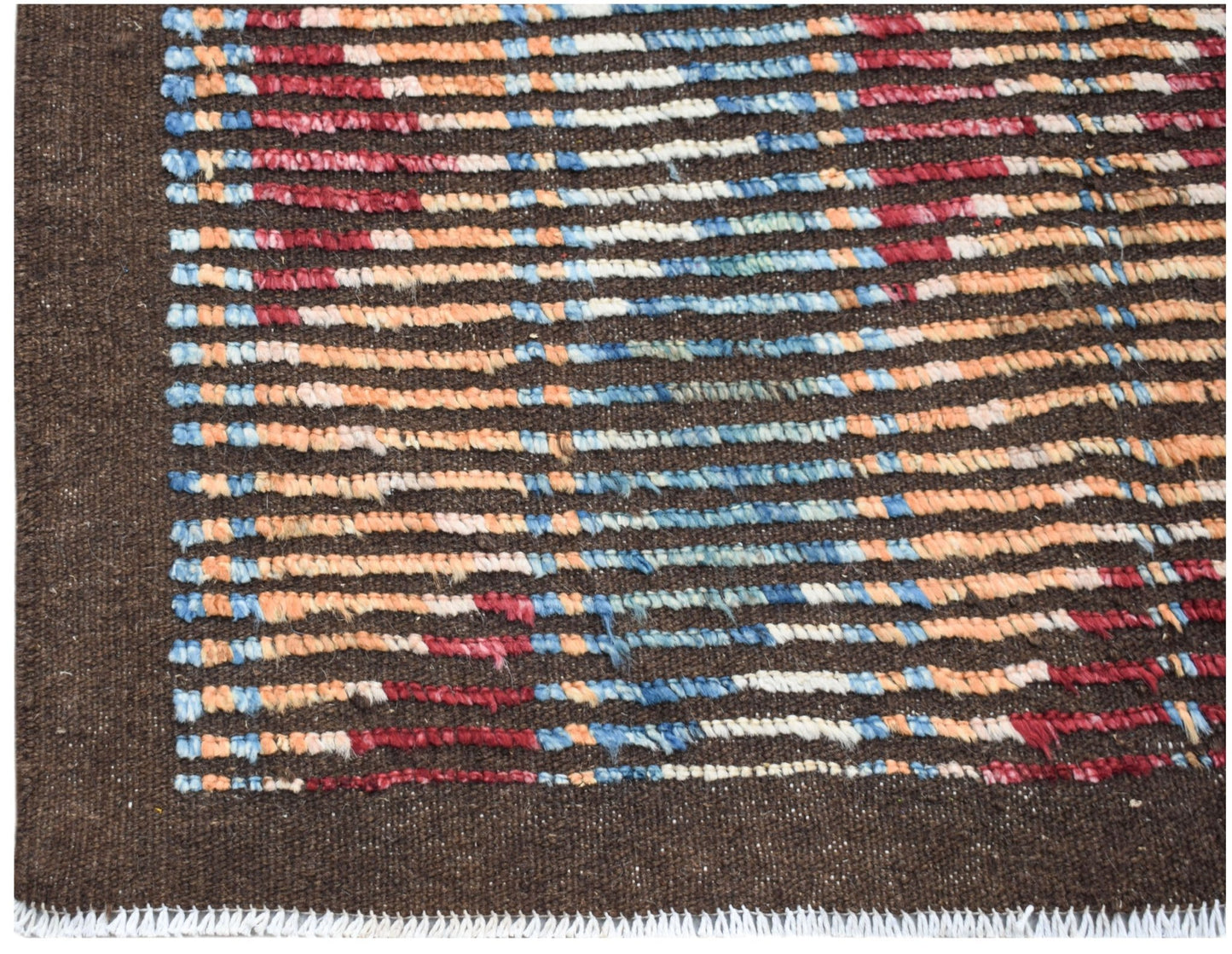 A hand-knotted Afghan rug featuring horizontal stripes of blue, red, and orange on a brown base.