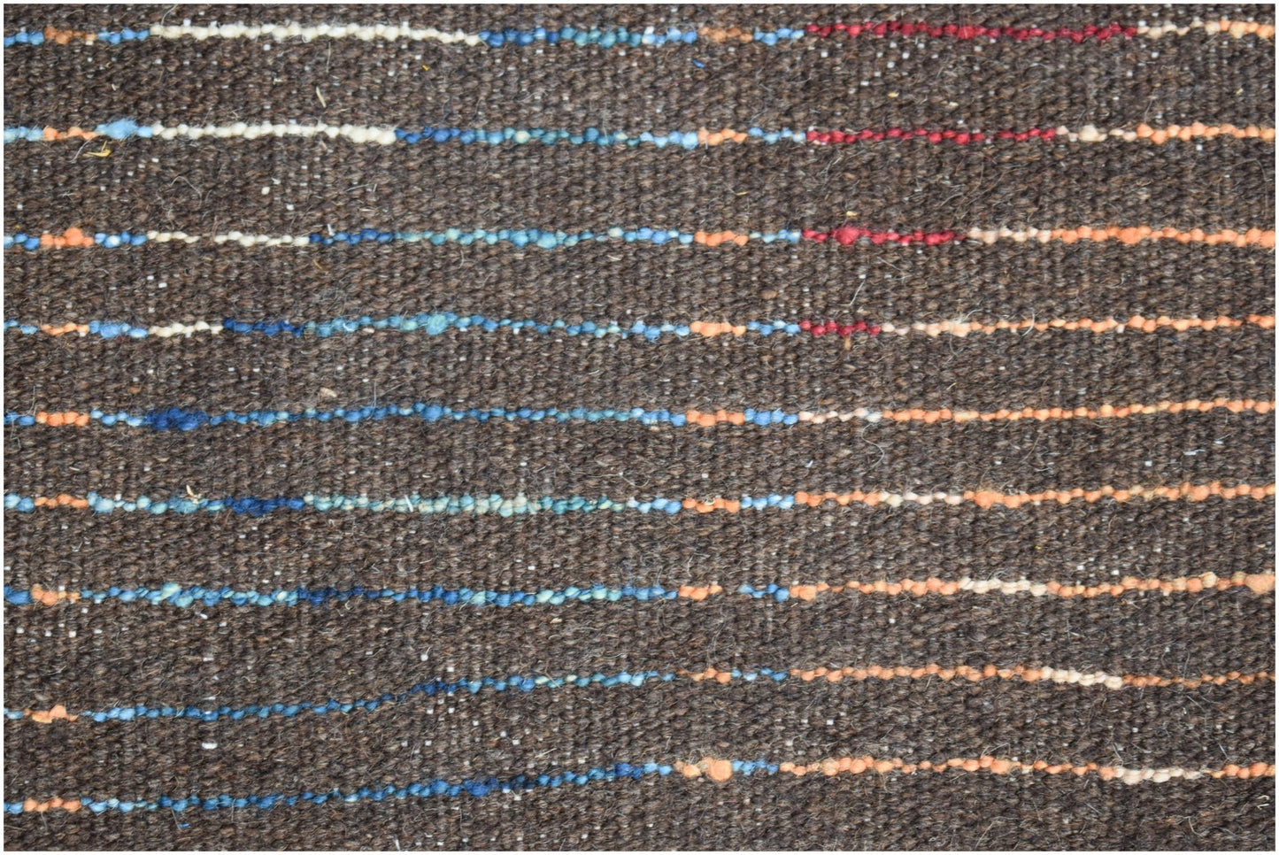 A dark brown hand-knotted Afghan wool rug featuring horizontal stripes of blue, red, and orange.