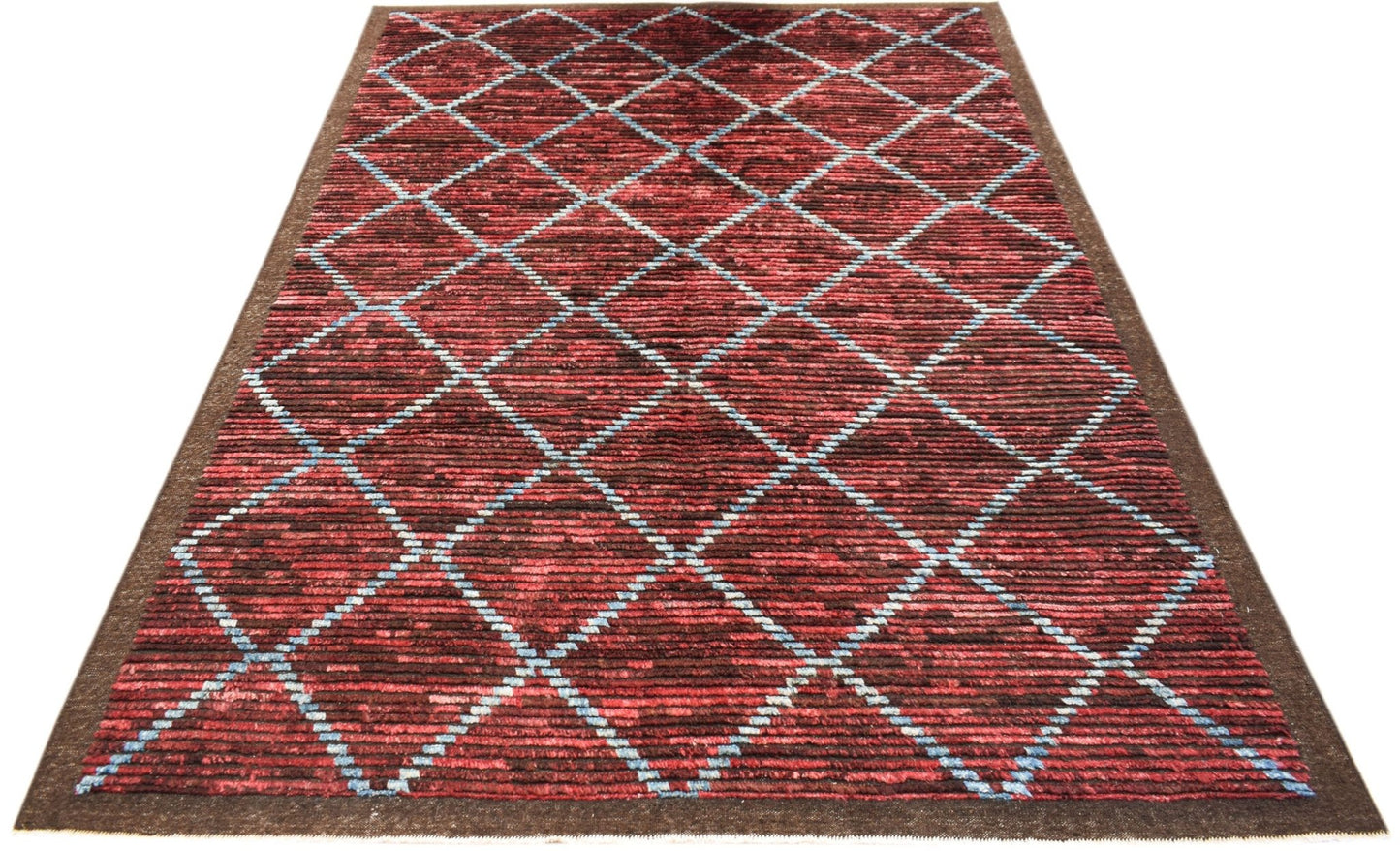 An Afghan Yekta rug featuring a red and black diamond pattern with blue accents.