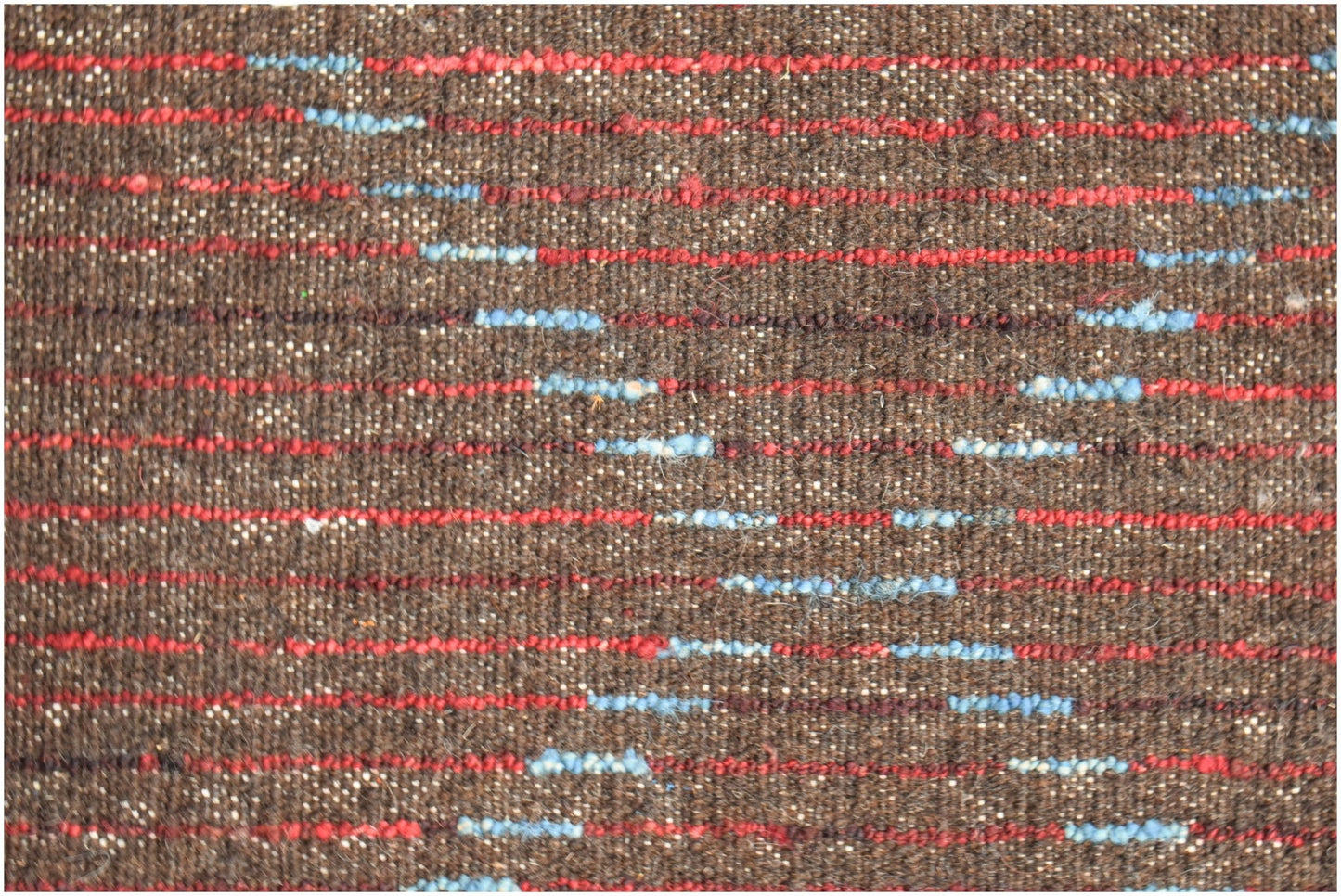 A brown hand-knotted Afghan wool rug featuring horizontal red and blue striped accents.