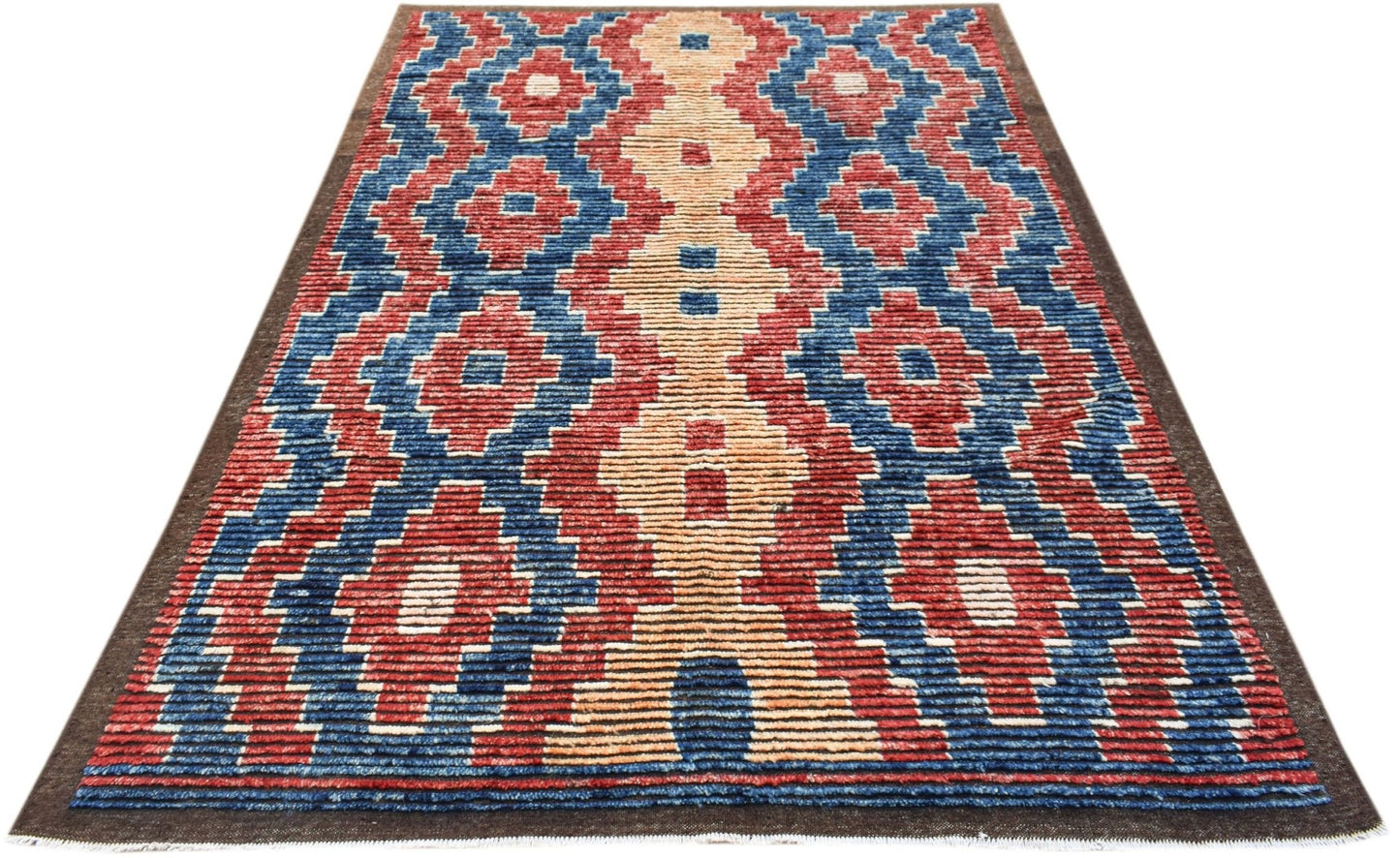 An Afghan Yekta rug featuring a bold geometric pattern in red, blue, and cream wool.