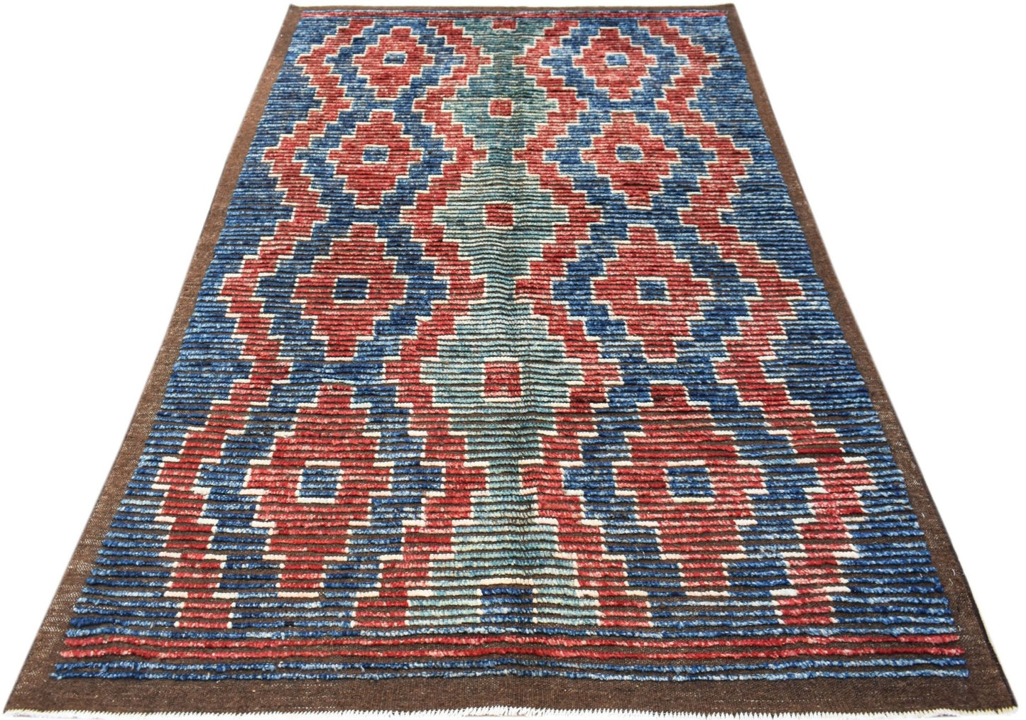 An Afghan Yekta rug featuring a geometric diamond pattern in red, blue, and light teal.