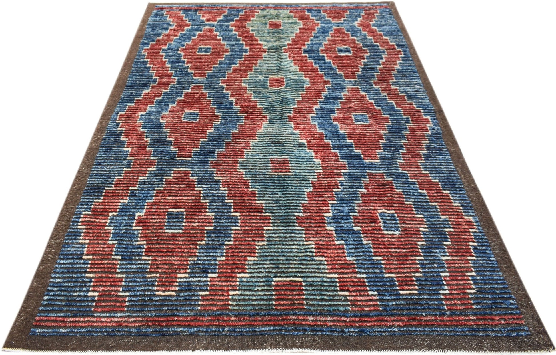 Hand-knotted Afghan Yekta rug featuring a bold geometric pattern in red, blue, and teal wool.