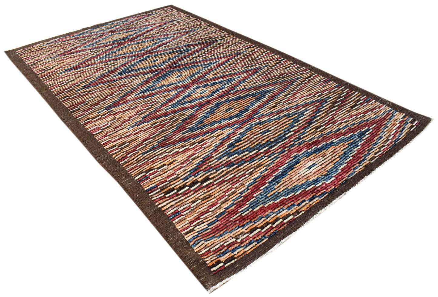 An Afghan Yekta rug featuring a vibrant, multi-colored geometric pattern on a hand-knotted wool base.