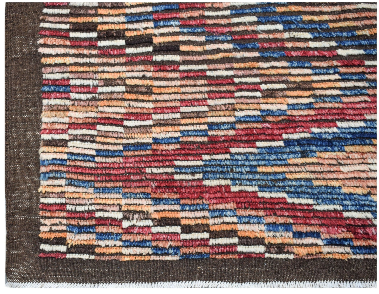 Hand-knotted Afghan rug featuring a multicolored geometric pattern on a dark brown background.