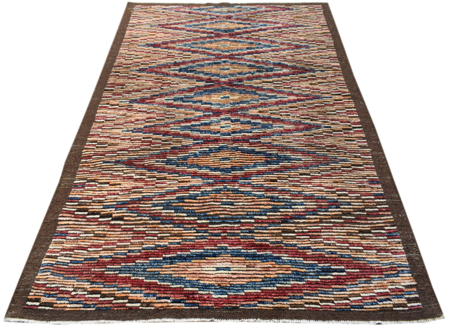 An Afghan Yekta rug featuring a geometric pattern in blue, red, and orange on a brown border.