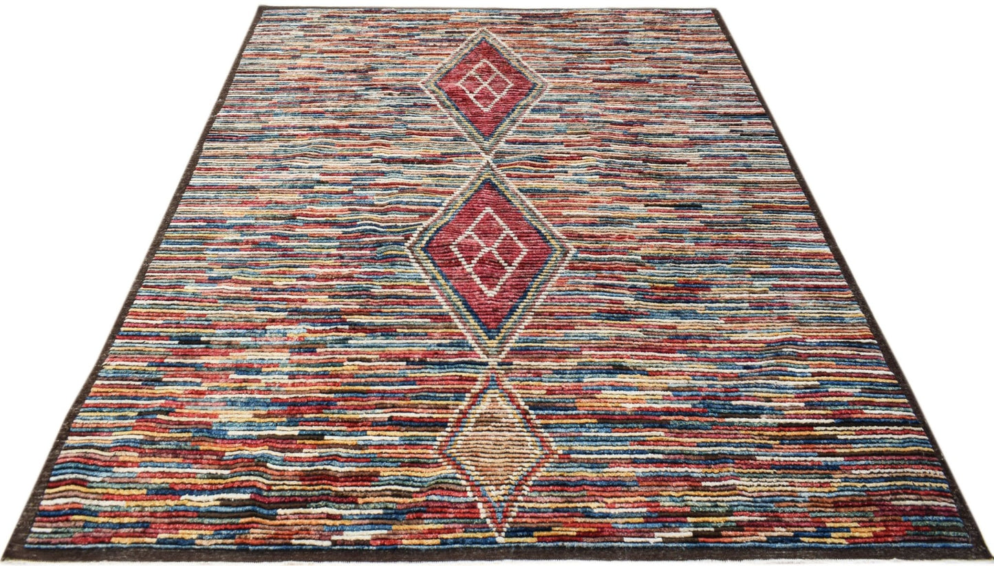 A hand-knotted Afghan rug featuring horizontal multicolored stripes and three central diamonds.