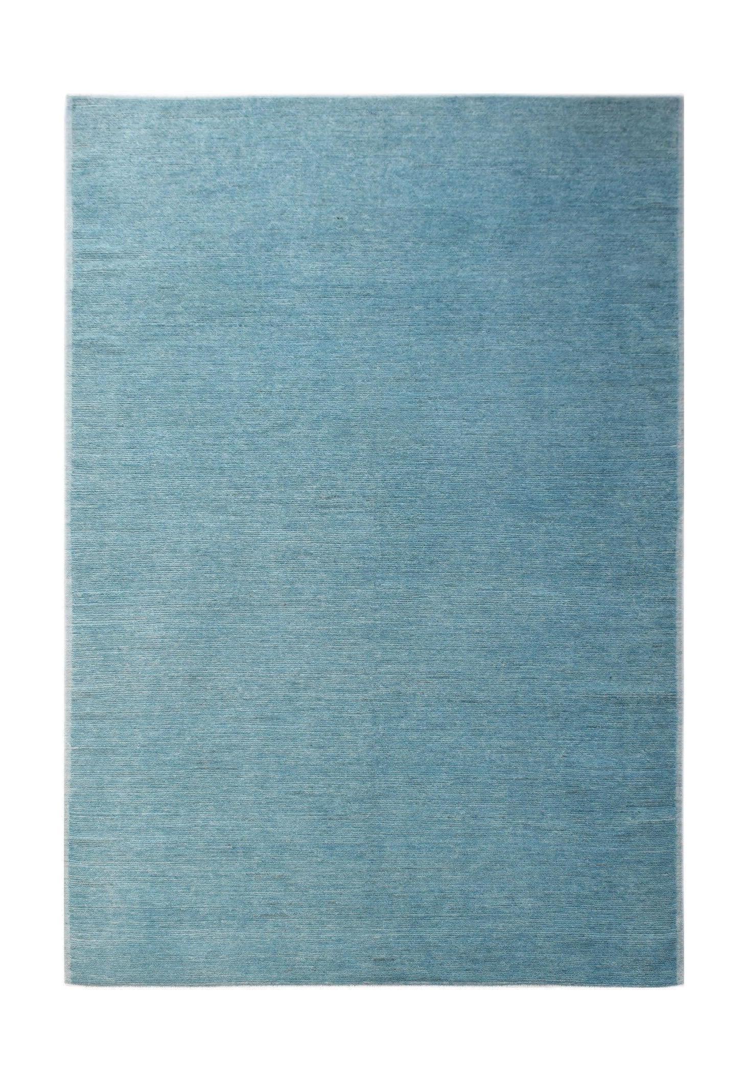 A rectangular Afghan Kohi rug in a solid, textured light blue wool with subtle color variations.