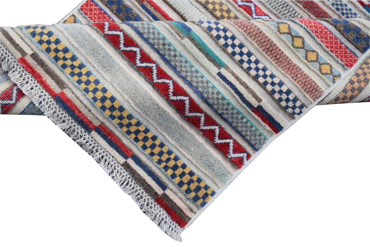 Handmade Afghan Yekta runner rug featuring a colorful geometric pattern with stripes and tassels.