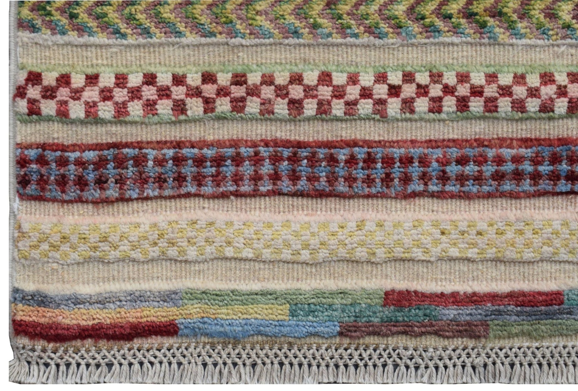 An Afghan Yekta runner featuring horizontal bands of colorful geometric patterns and fringe ends.