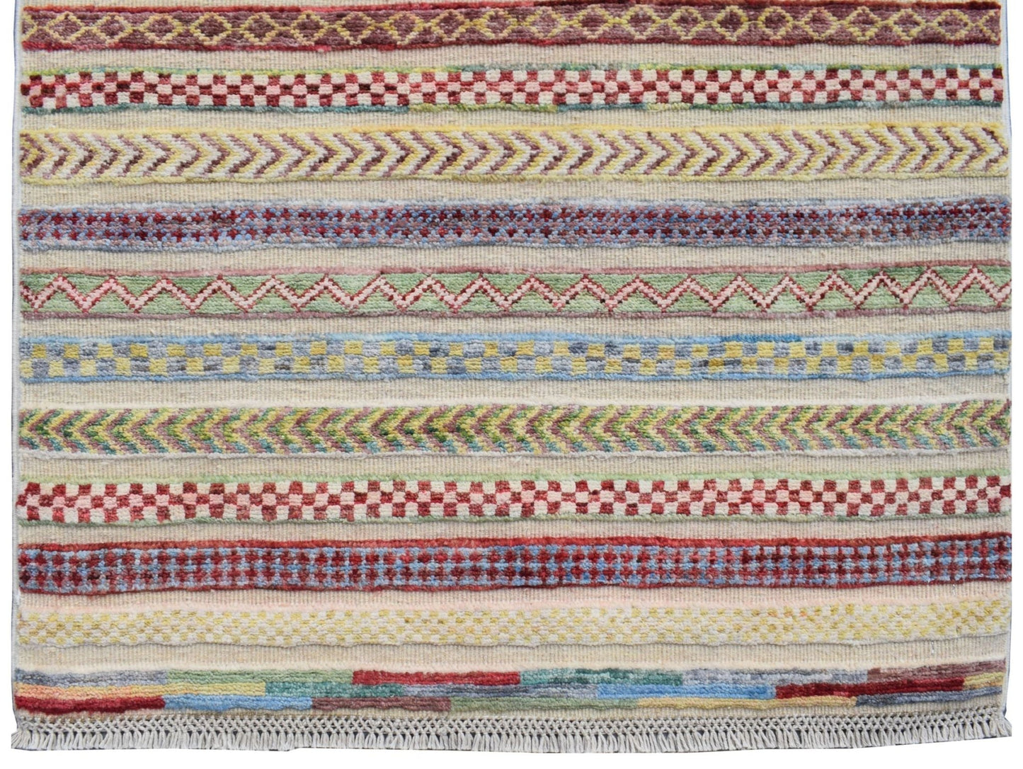 Handmade Afghan Yekta runner rug featuring colorful horizontal bands of geometric patterns.