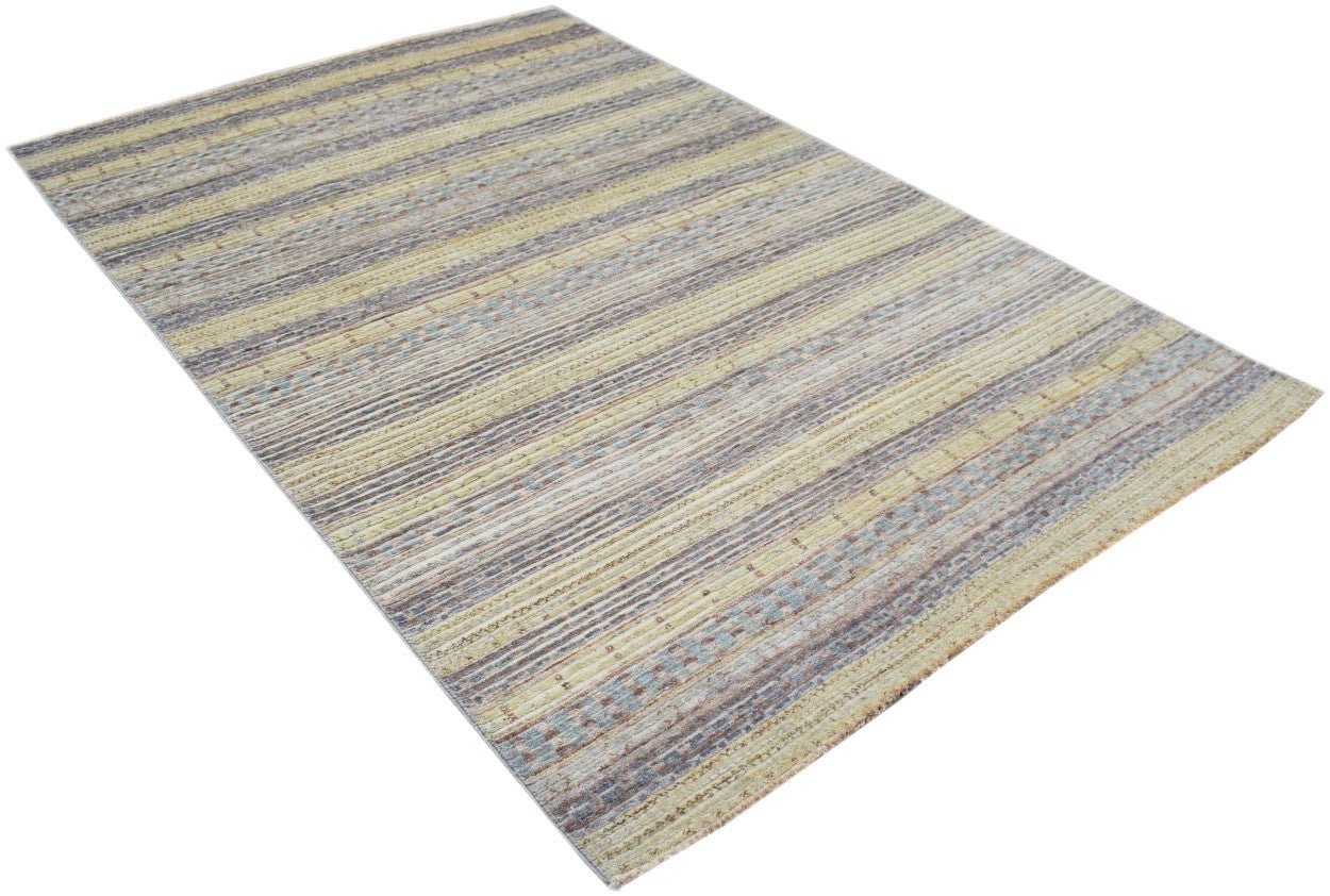 Handmade Afghan Yekta rug featuring a textured, striped pattern in muted yellow and blue tones.