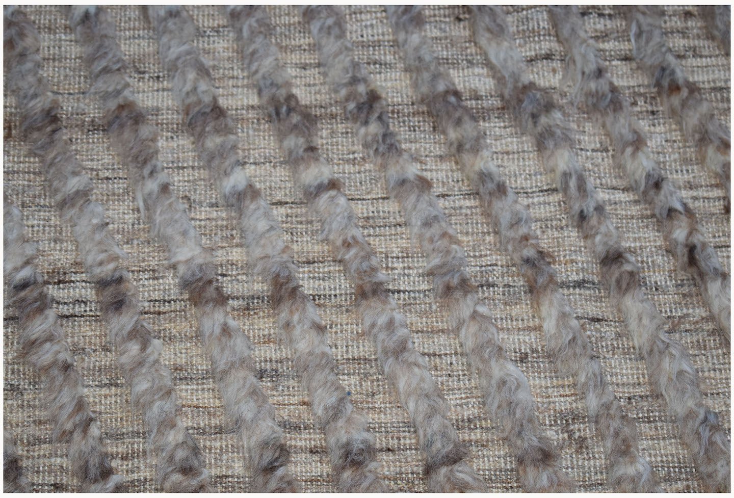 An Afghan Yekta rug featuring a textured pattern of raised wool stripes on a flatwoven base.