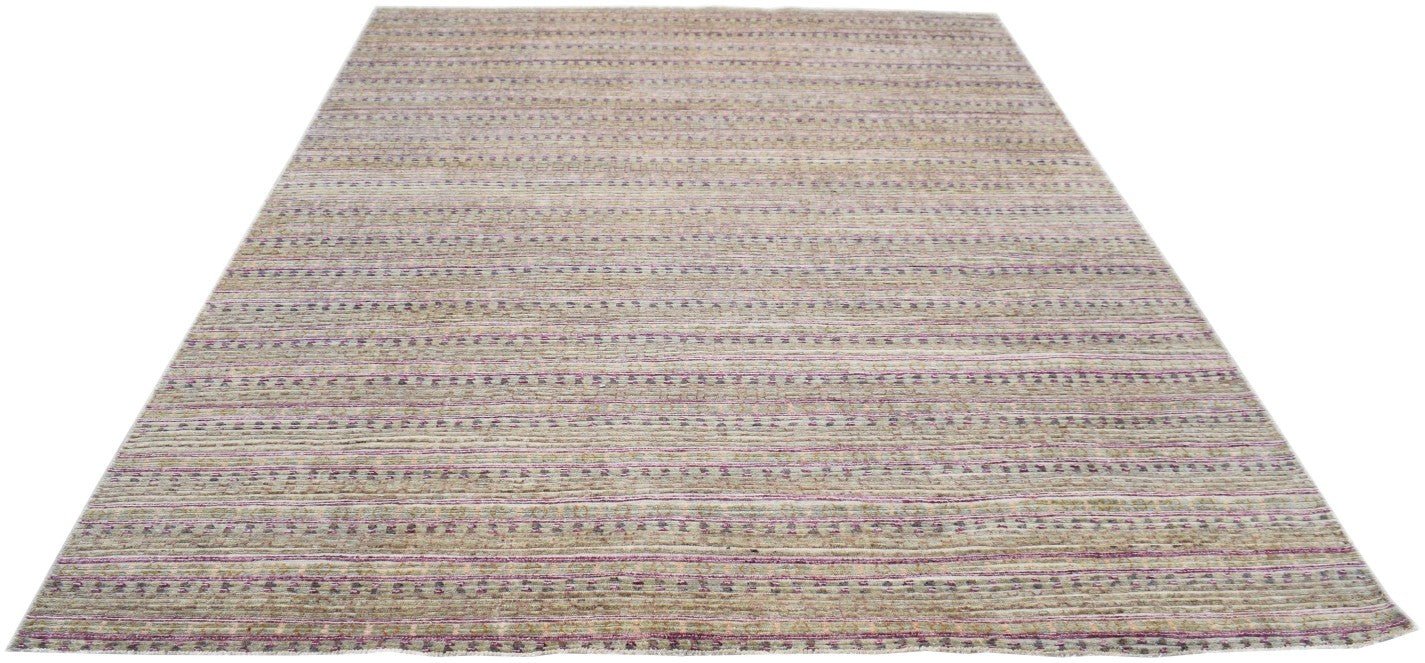 Handmade Afghan Yekta rug featuring a textured, striped pattern in muted earth tones and purple.
