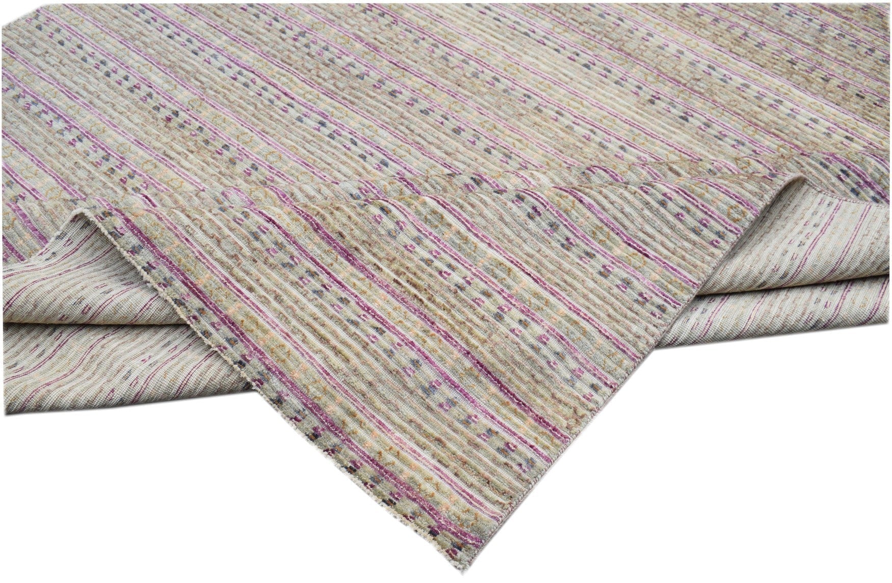 An Afghan Yekta rug featuring a textured, striped pattern in shades of beige, purple, and grey.