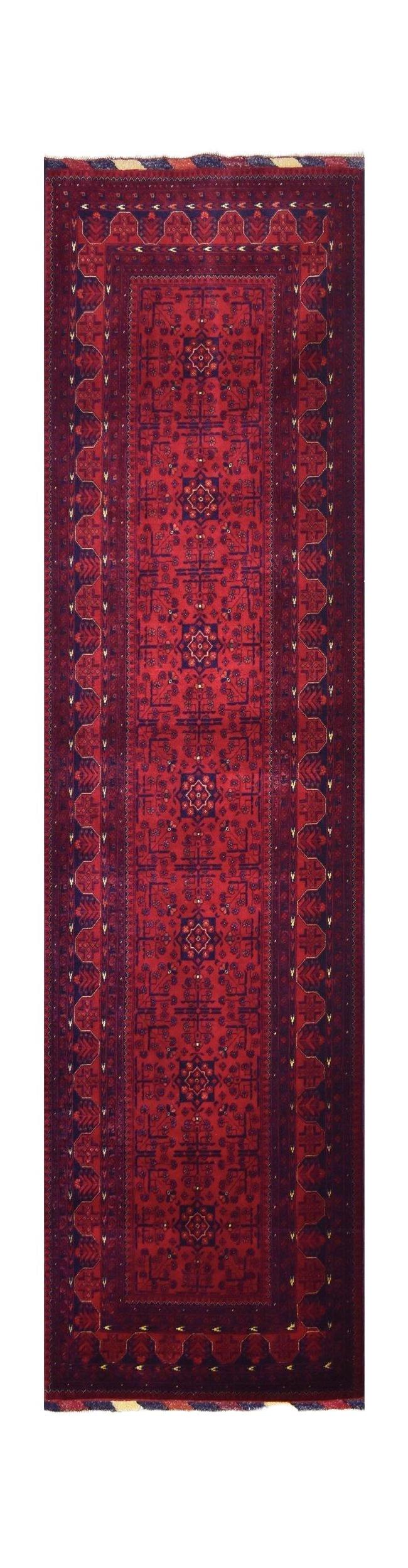 A handmade Afghan Biljik runner featuring deep red and blue tones with intricate geometric patterns.