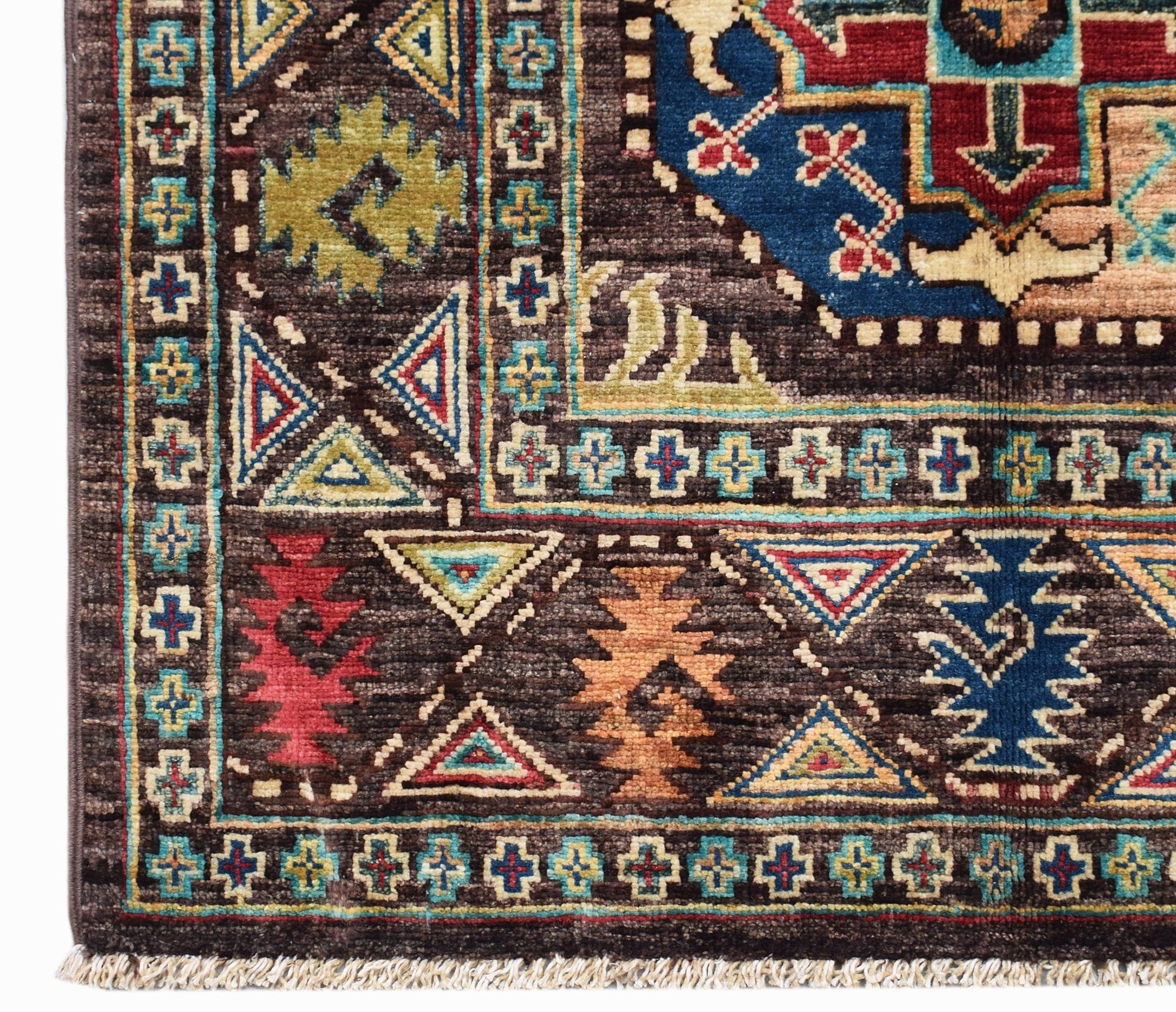 A handwoven Afghan Chobi runner featuring a dark brown field with geometric tribal patterns.