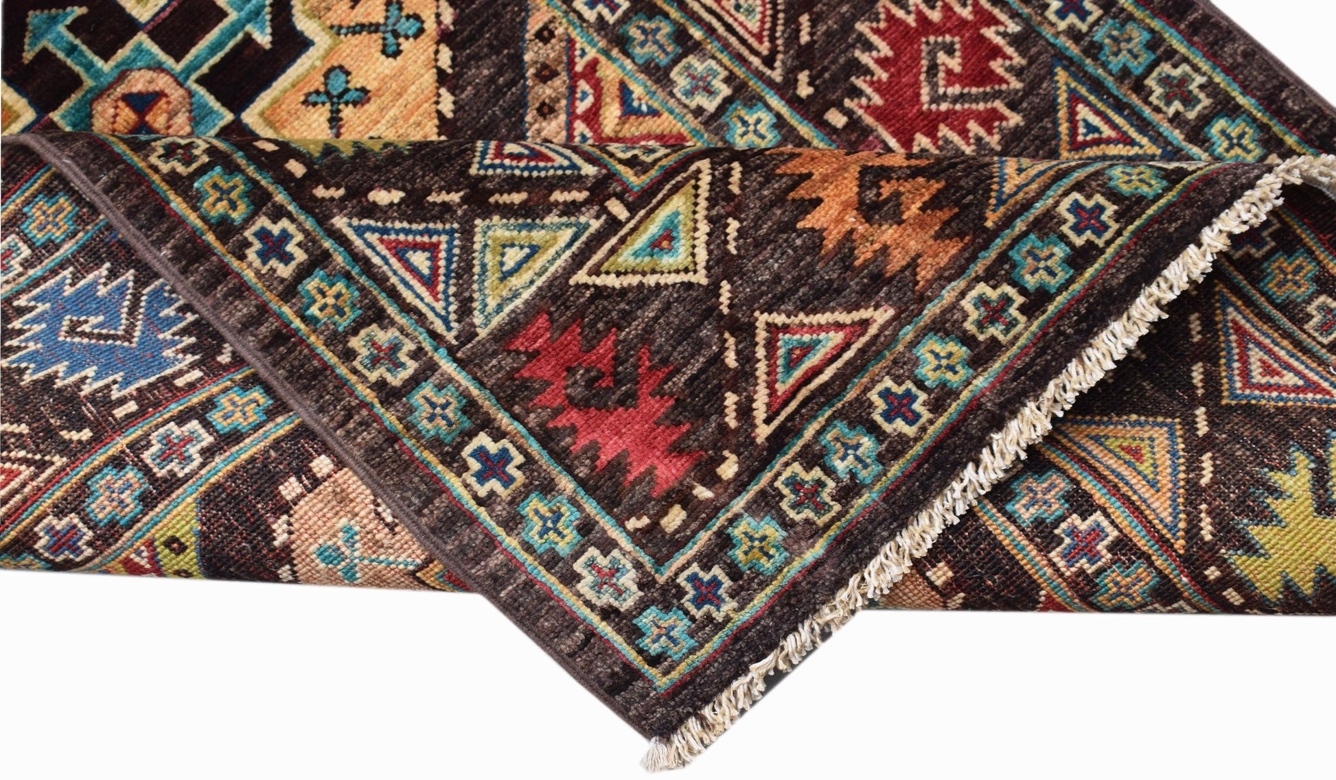 A handwoven Afghan Chobi runner featuring geometric patterns in earthy tones and a fringed edge.