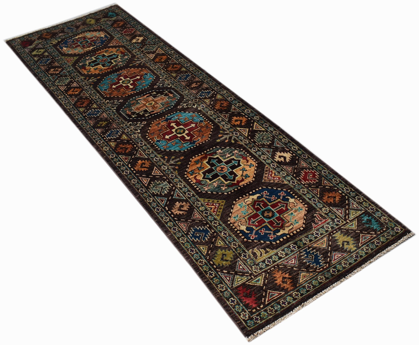 A handwoven Afghan Chobi runner rug featuring geometric medallions in earthy tones.