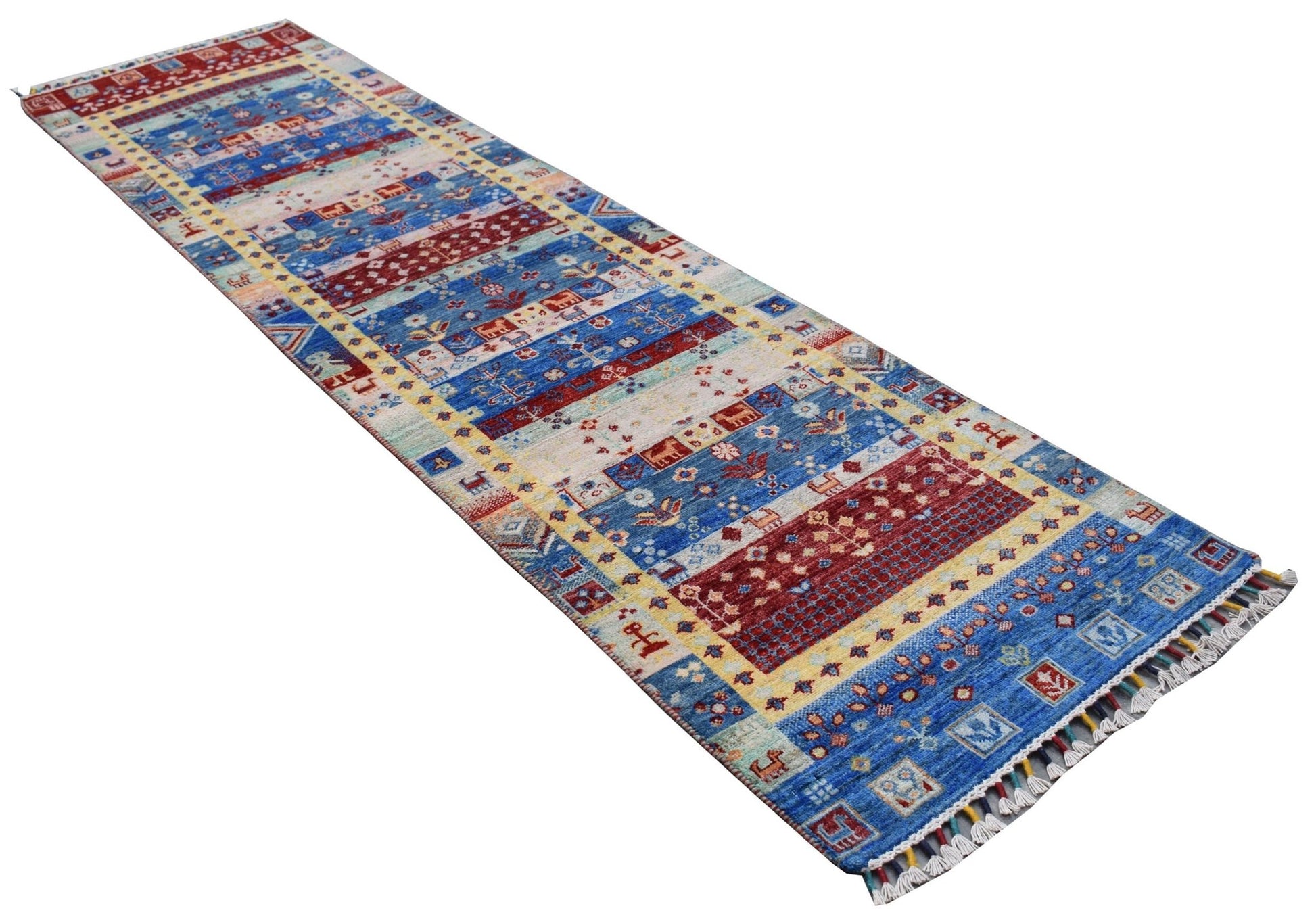 A handmade Afghan Chobi runner rug featuring a vibrant geometric pattern in blue, red, and cream.