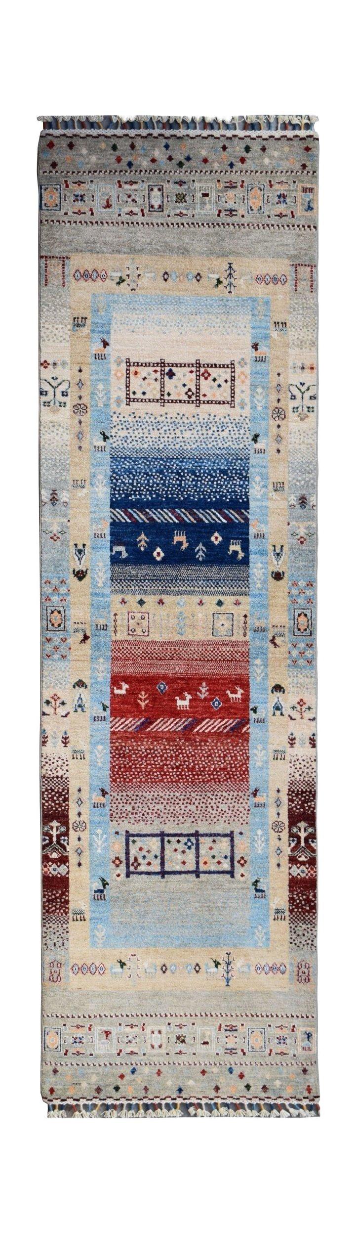 Handmade Afghan Chobi runner rug featuring a colorful geometric pattern on a light blue background.