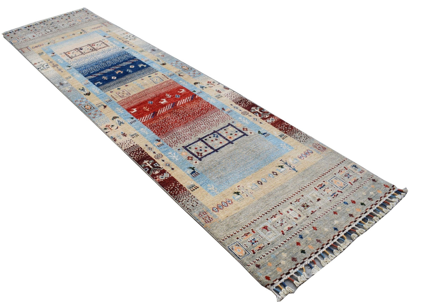 A handmade Afghan Chobi runner rug featuring a colorful geometric pattern on a light blue background.