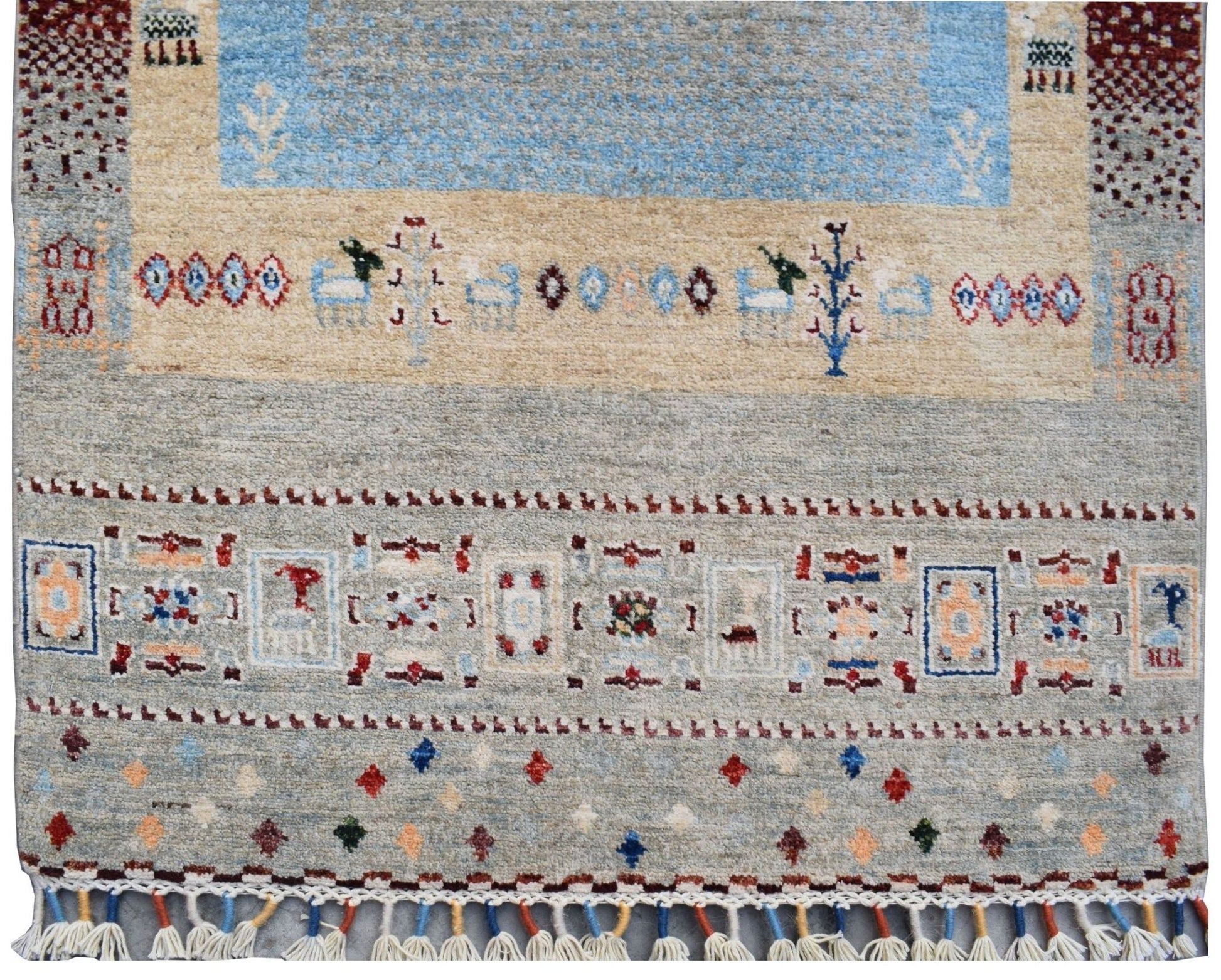 Handmade Afghan Chobi runner rug featuring traditional geometric patterns in soft earthy tones.