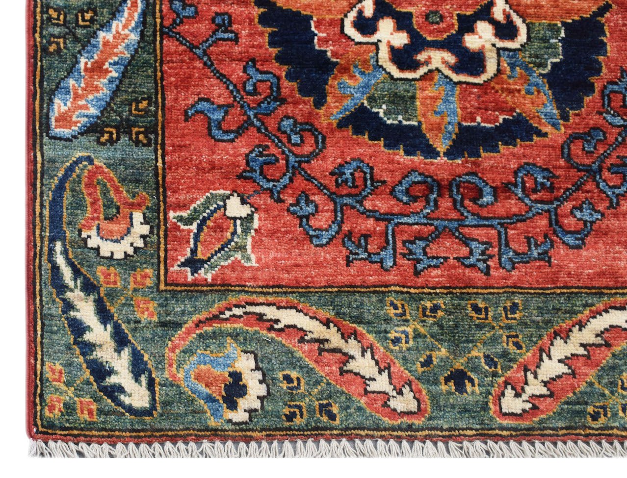 A handmade Afghan Chobi runner featuring a traditional floral pattern in red, blue, and green.