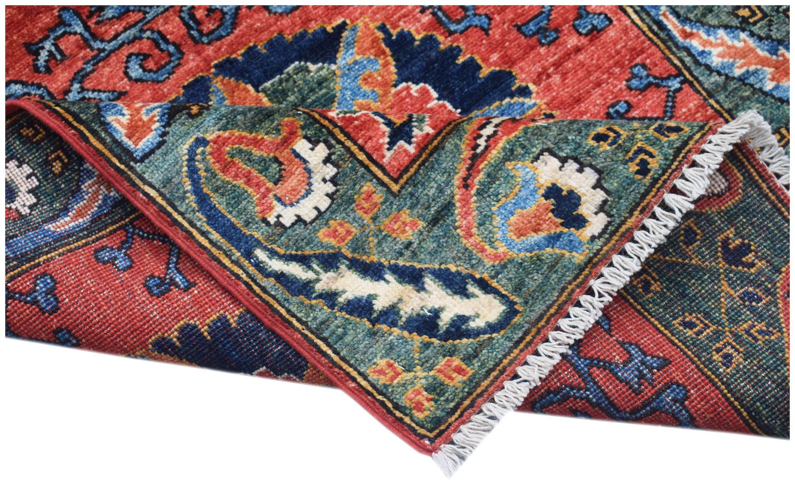 A corner view of a handwoven Afghan Chobi runner featuring traditional floral patterns in wool.