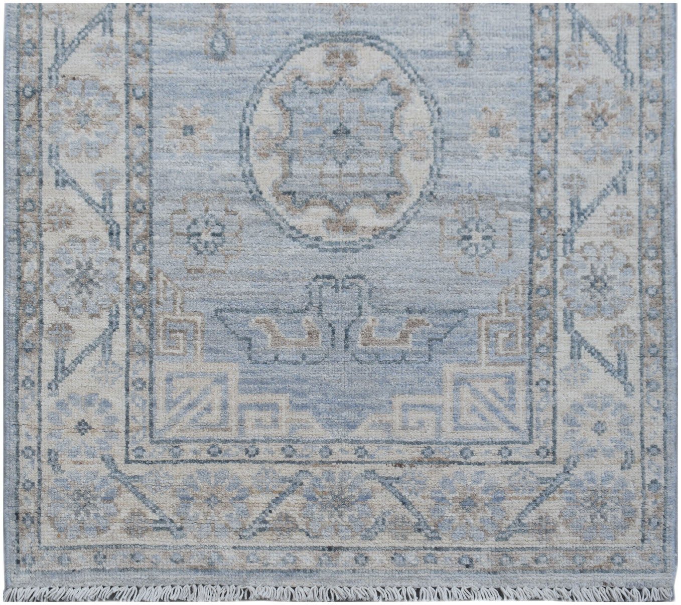 An Afghan Chobi runner featuring a traditional blue and beige geometric pattern with fringe.