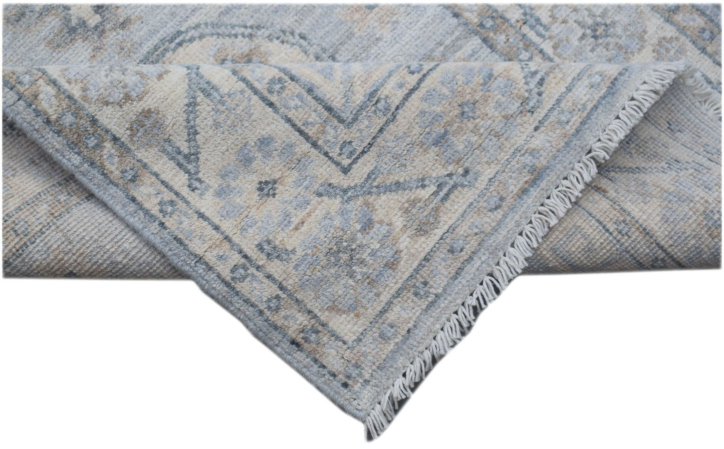 A handmade Afghan Chobi runner featuring a traditional floral pattern in soft blue and beige tones.