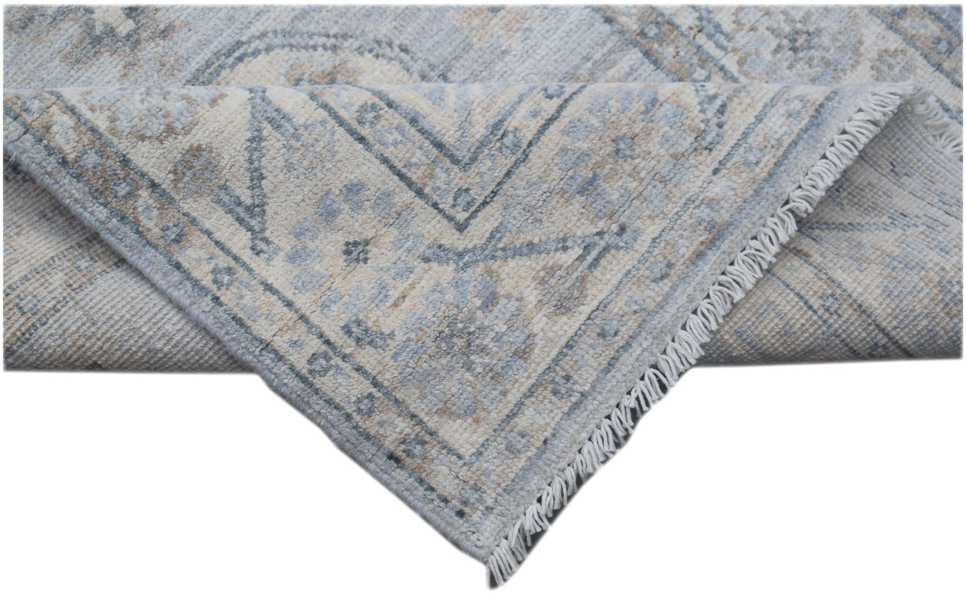 A handmade Afghan Chobi runner featuring a traditional floral pattern in soft blue and beige tones.