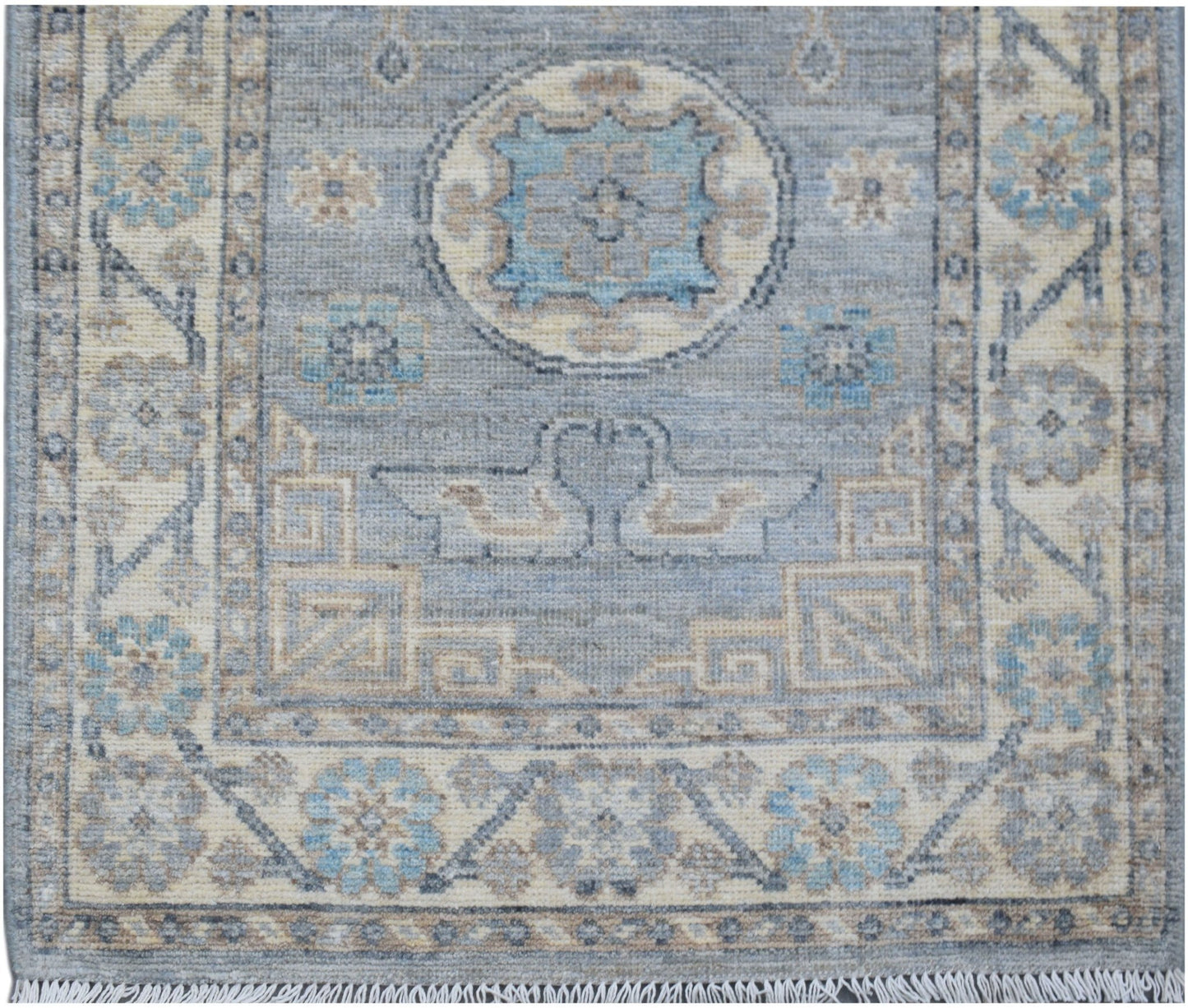 Handmade Afghan Chobi runner featuring a blue field with geometric motifs and a fringed edge.