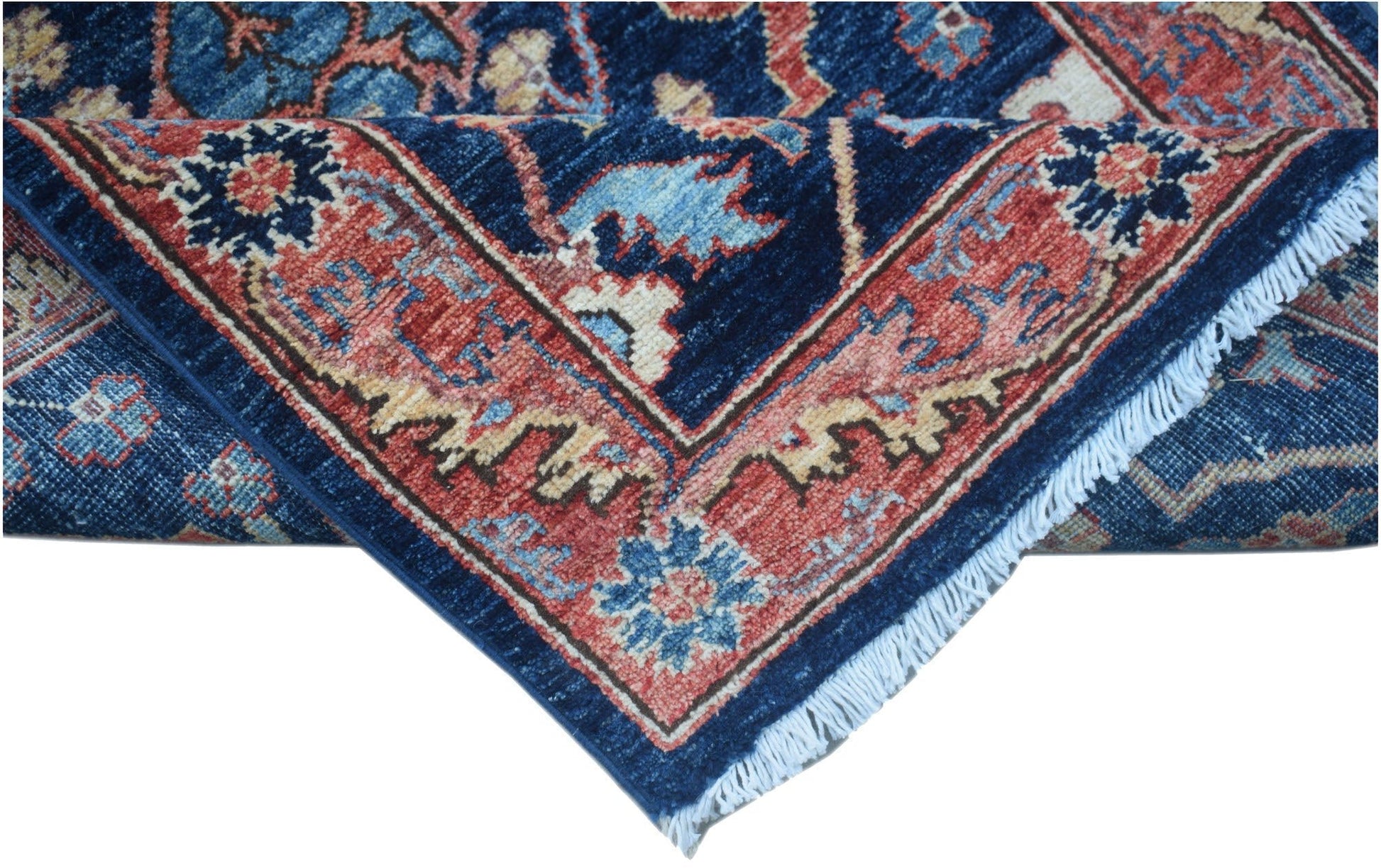 A handmade Afghan Chobi runner featuring a traditional floral pattern in blue, red, and cream.
