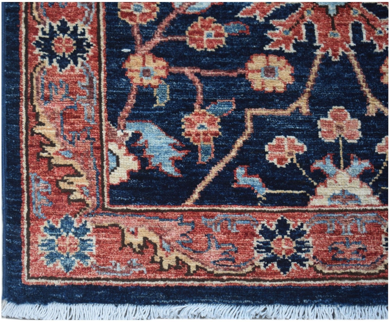 A handmade Afghan Chobi runner featuring a traditional floral pattern in red and blue tones.