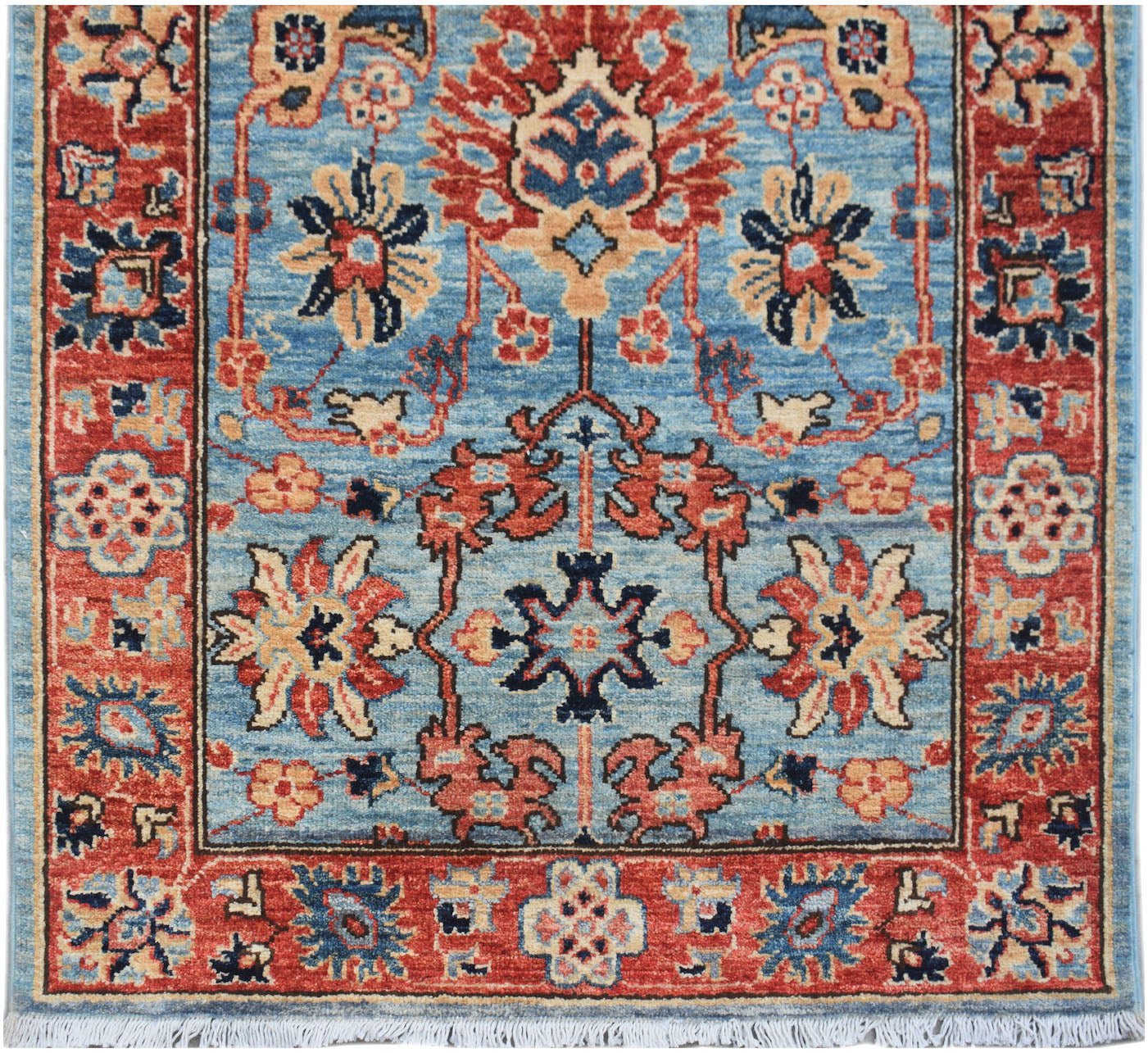 Handmade Afghan Chobi runner rug featuring a traditional floral pattern in blue and red tones.