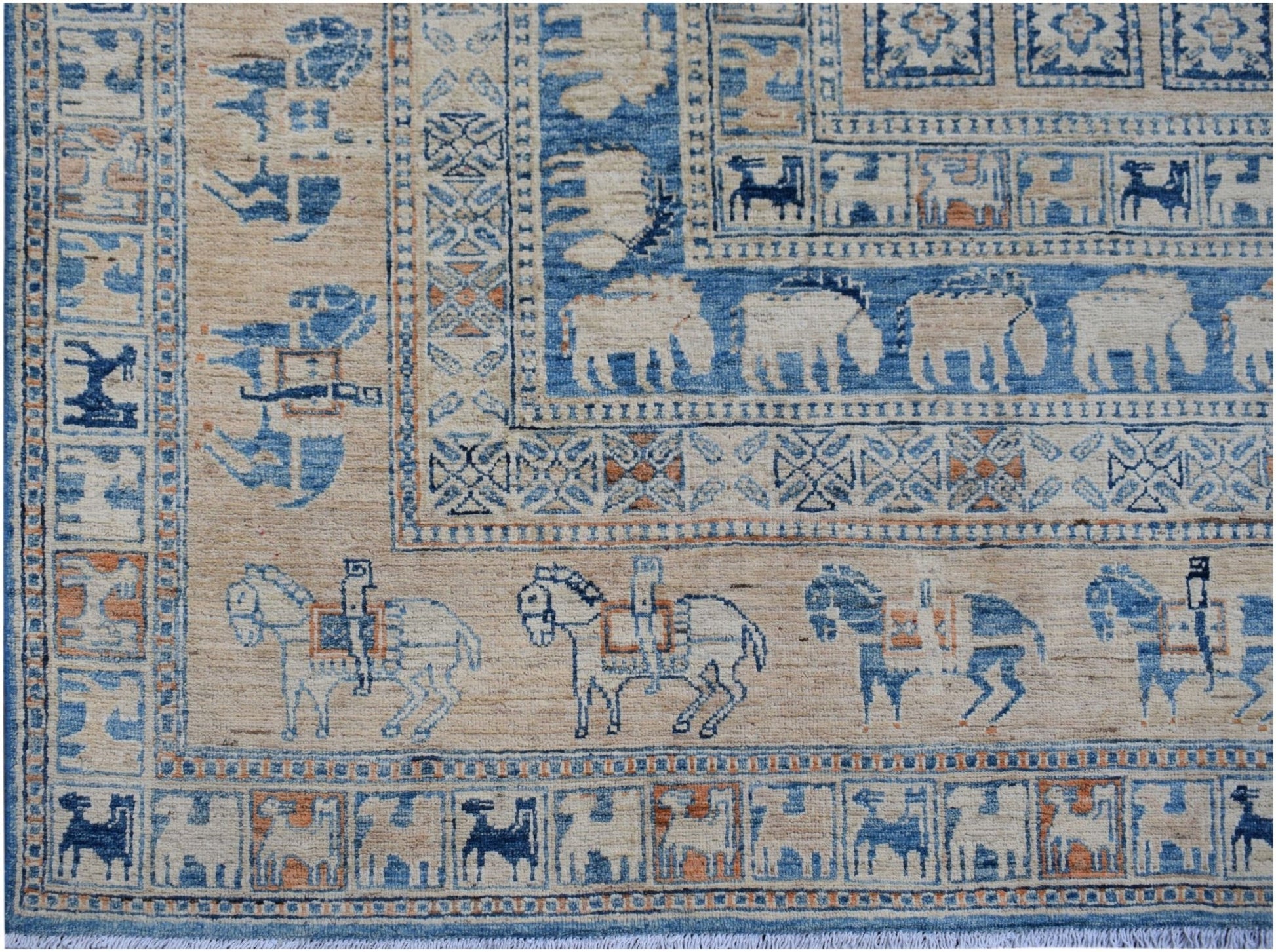 Handmade Afghan Chobi rug featuring a Pazyryk-inspired pattern of horses and geometric borders.