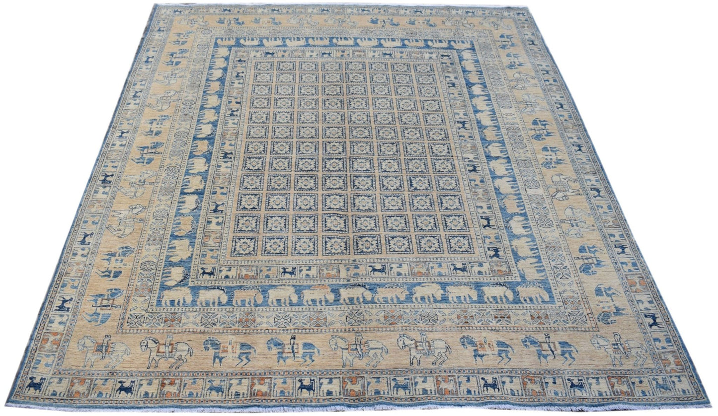 Handmade Afghan Chobi rug featuring a Pazyryk-inspired grid pattern with animal and rider motifs.