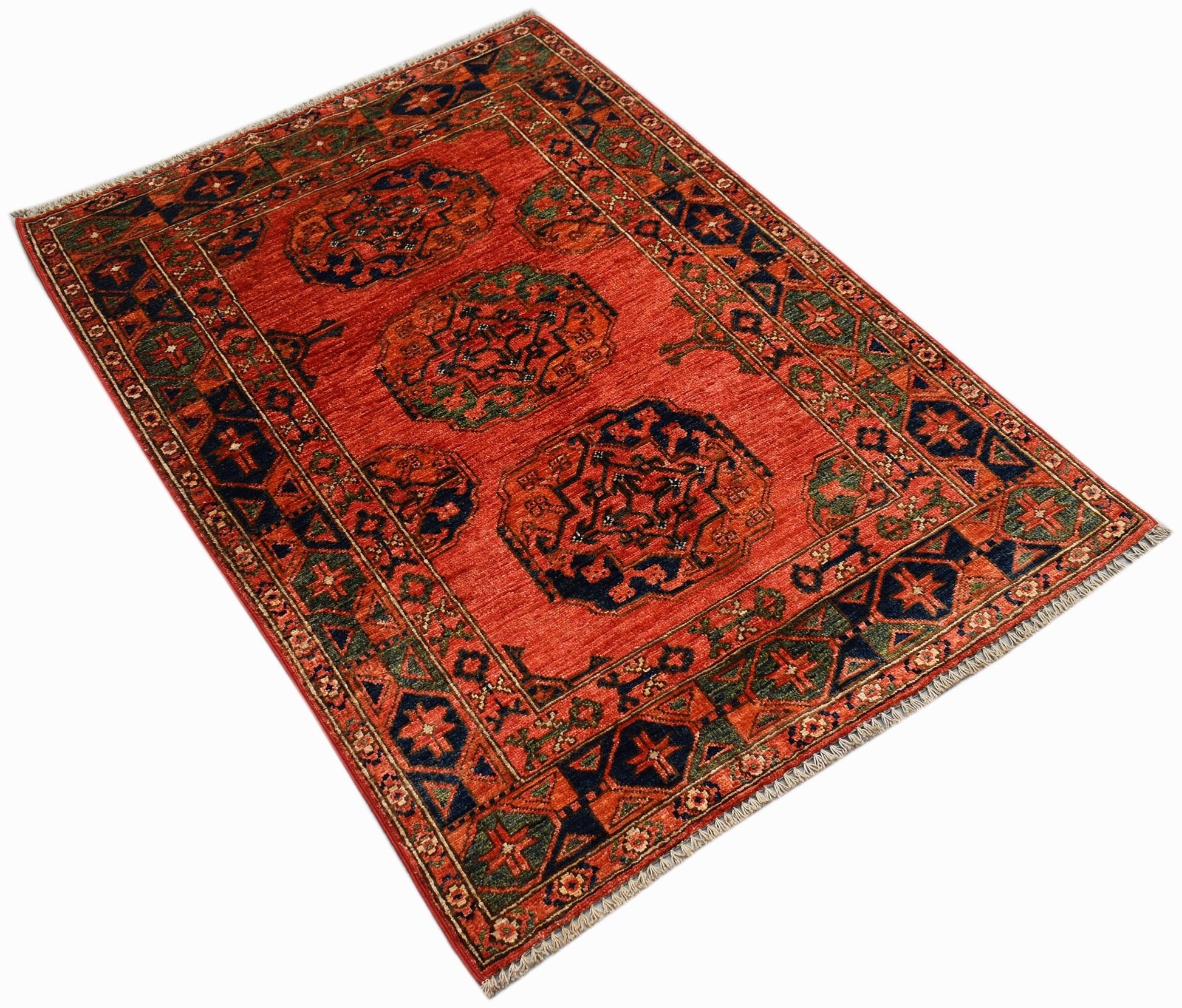 A rectangular Afghan Chobi rug featuring traditional geometric medallions on a red background.